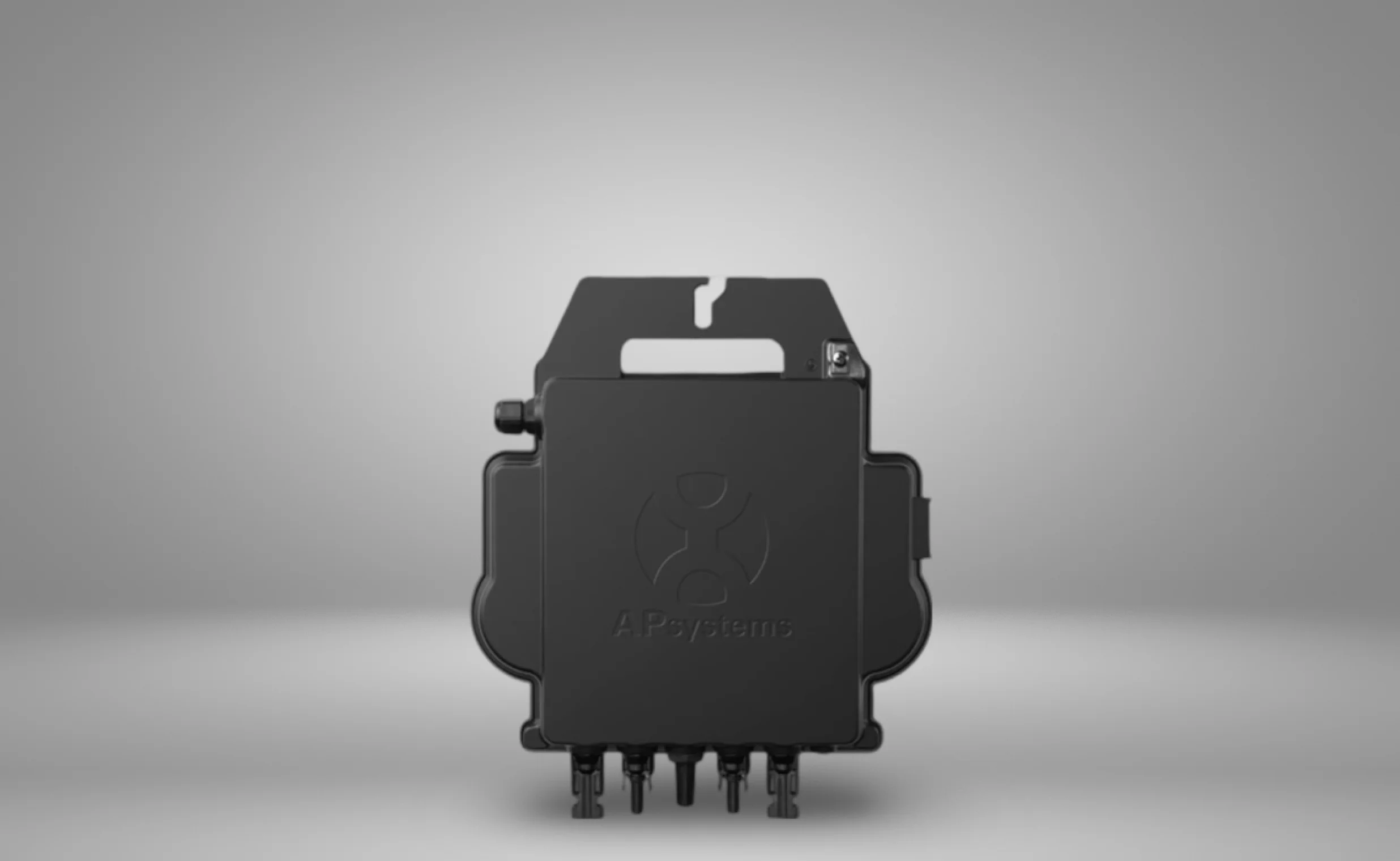 An ap system micro inverter lying on the gray wall