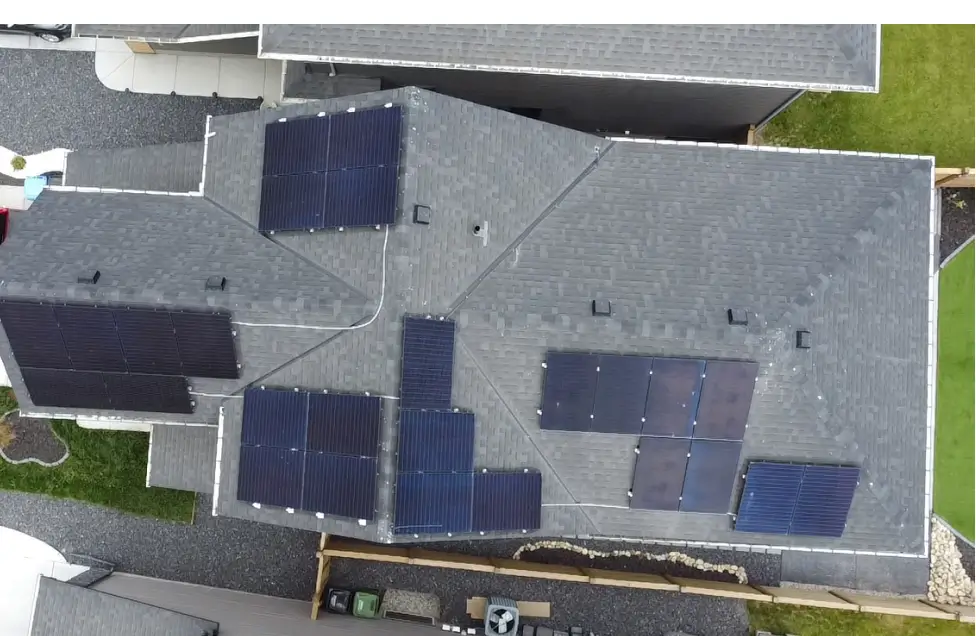 Aerial view of a completed Ontario home solar installation with sleek black panels, verified by a satisfied customer review for Polaron’s after-service care.